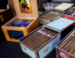 Boxes on boxes of cigars sitting on a table