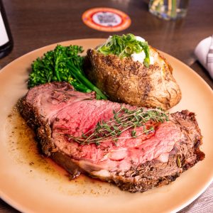 Prime steak and potato plated at Three Peaks restaurant