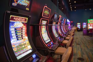 Row of slot machines with Fireball Frenzy machine being featured at the front