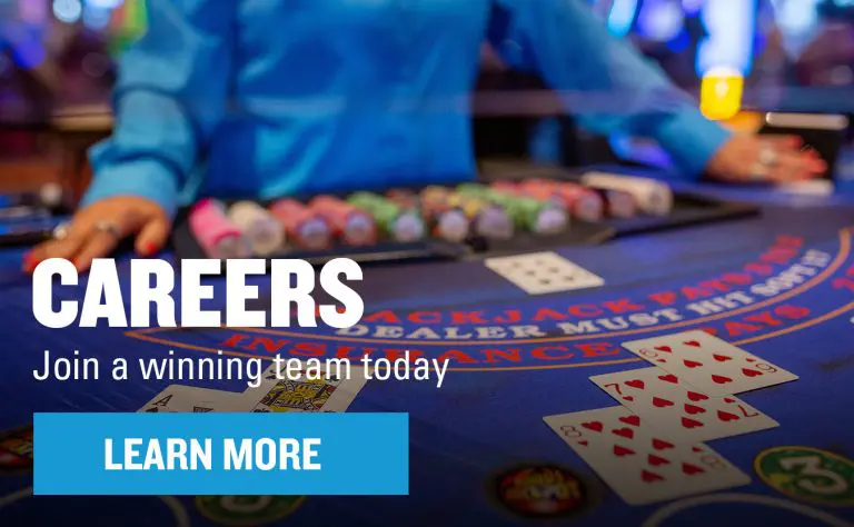 Dealer at table behind "Careers" graphic