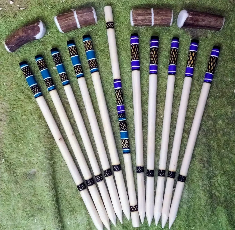 Traditional Native American stick game playing tools including marked bones and hand sticks used in cultural guessing games