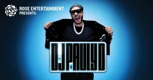 Promotional poster: man in sunglasses pulls open jacket against a blue glow, with 'Rose Entertainment Presents' text in the corner and a glowing 'DURAD' title.