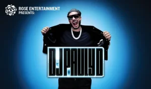 Rose Entertainment presents DJ Pauly D: DJ Pauly D in sunglasses reveals his logo on a blue glow background.