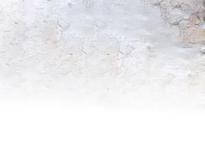 Weathered white plaster wall with peeling paint and rough texture.