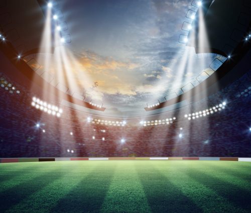 Lights at night in a stadium with a field 3D render